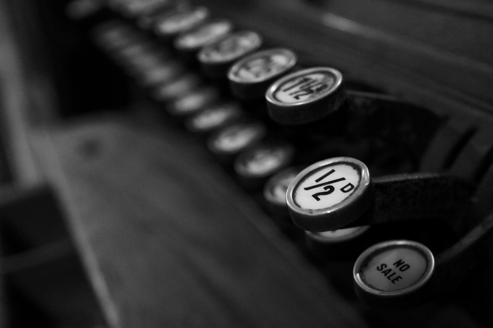 grayscale photo of black and white typewriter