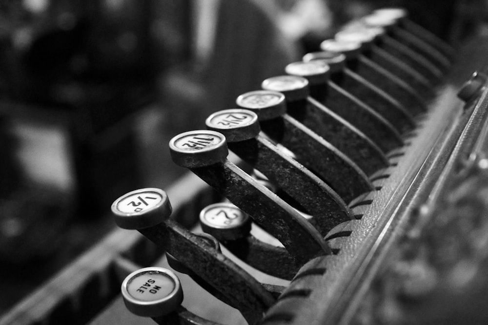 grayscale photo of typewriter keys