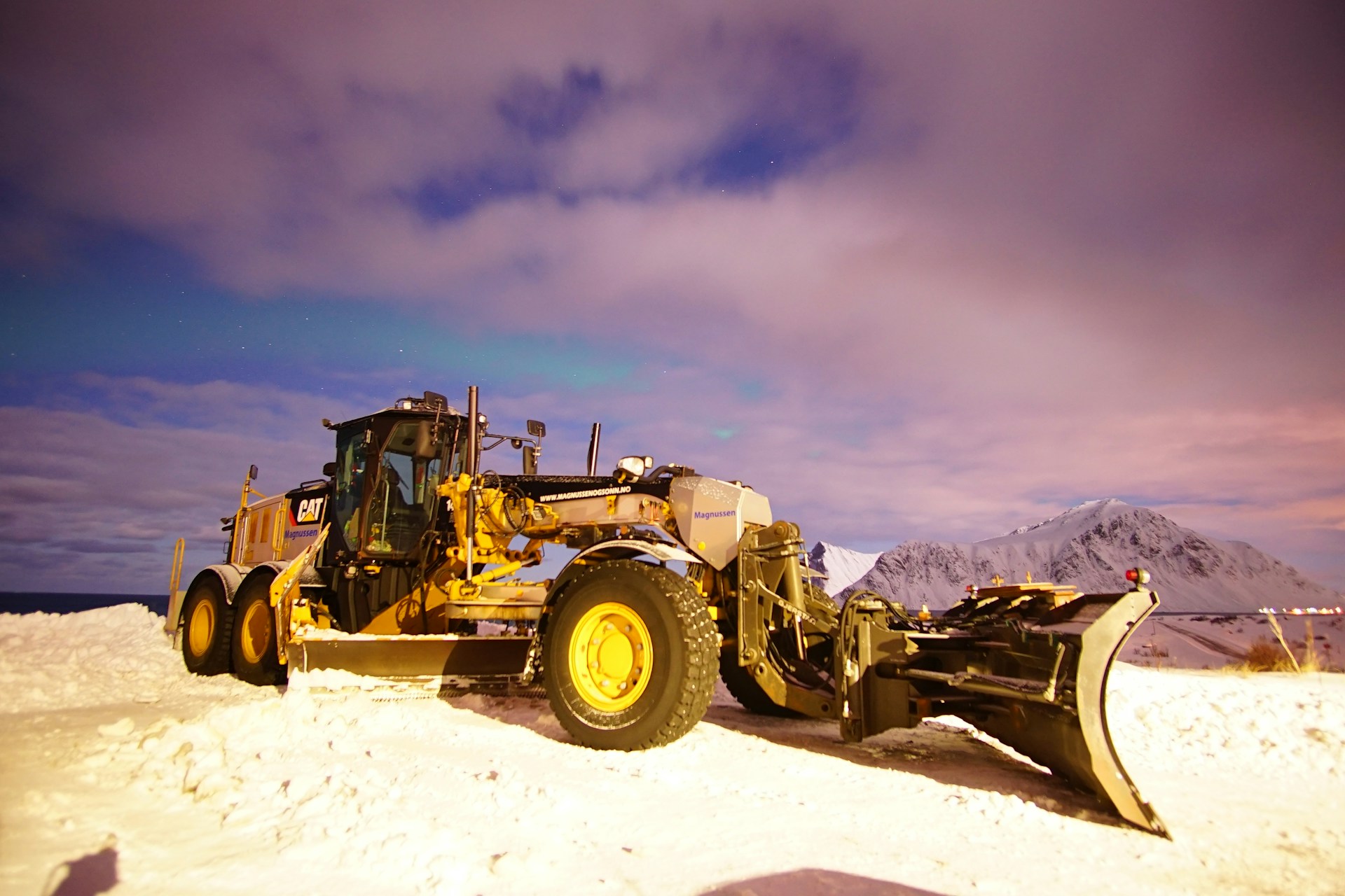 woman wearing yellow long-sleeved dress under white clouds and blue sky during daytime