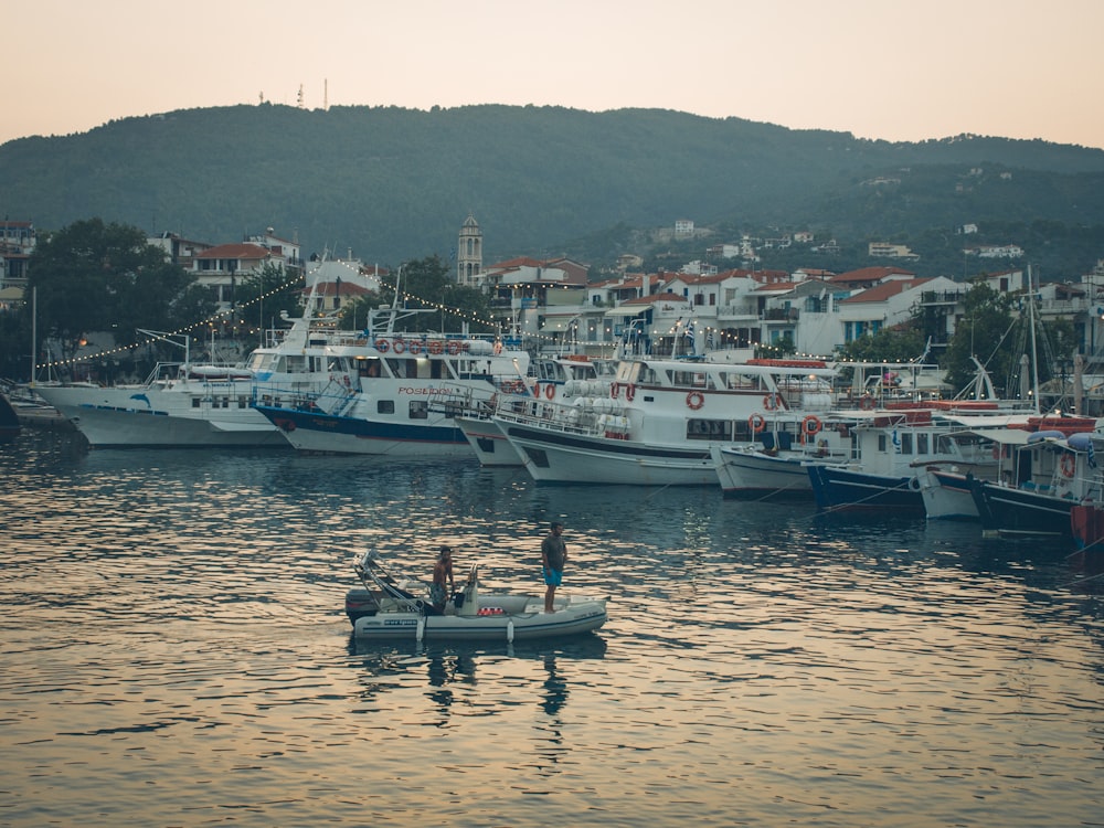 white and black boat on sea during daytime