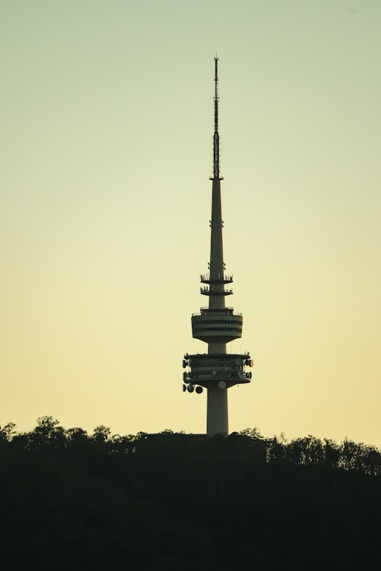 black tower under gray sky in Canberra ACT Australia