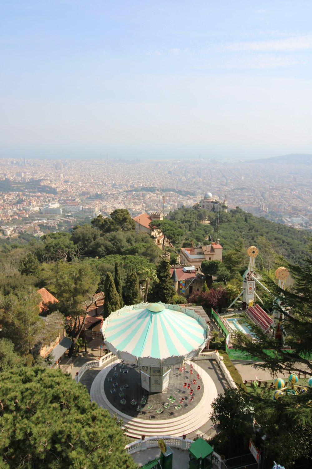 green umbrella on top of the mountain