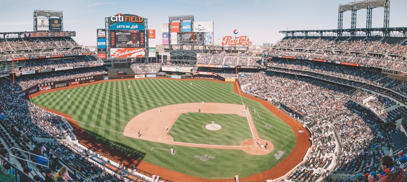 baseball field, baseball game, players in uniform, tournament scoreboard, victory celebration