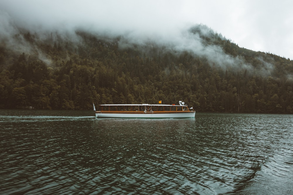 white boat on body of water during daytime