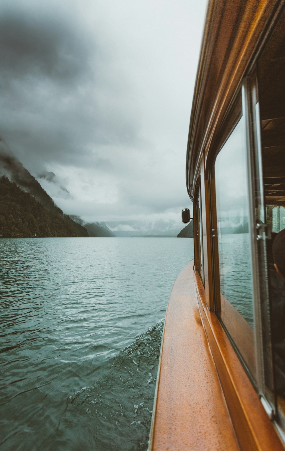 brown boat on sea during daytime