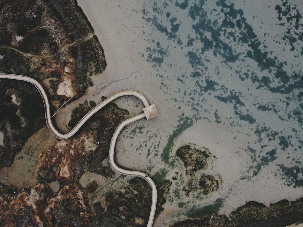 white and black coated wires on blue and white surface