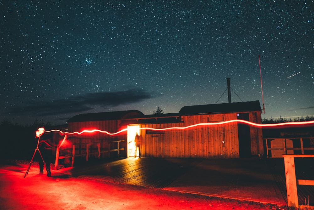 brown wooden fence under starry night