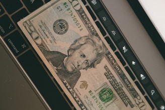 Photo of Andrew Johnson working at his desk with financial documents and a laptop.
