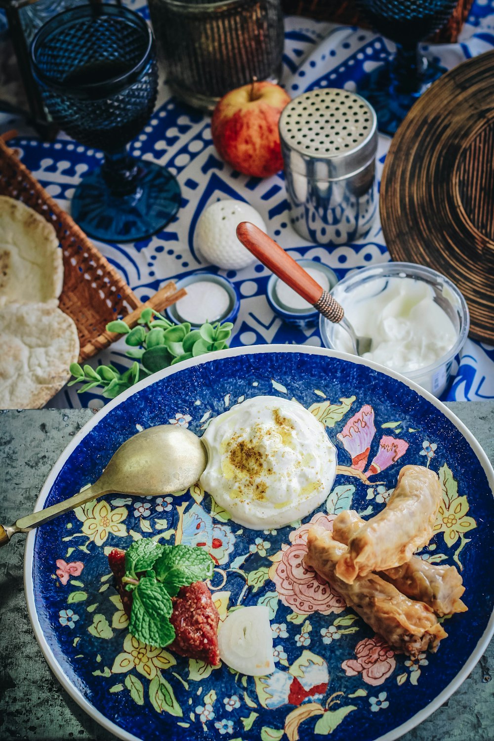 stainless steel spoon on blue ceramic bowl