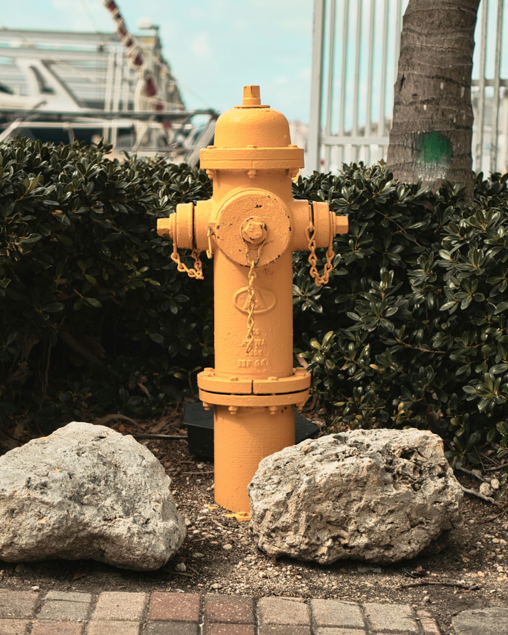 brown fire hydrant on gray rock