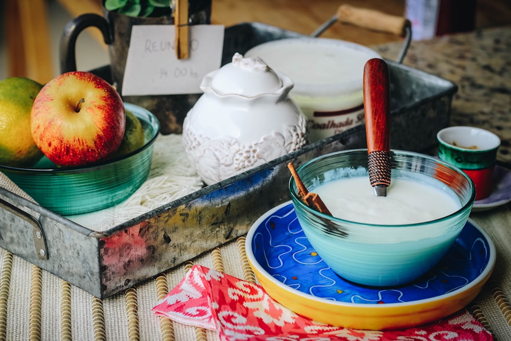 white and blue ceramic bowl on blue and white ceramic plate