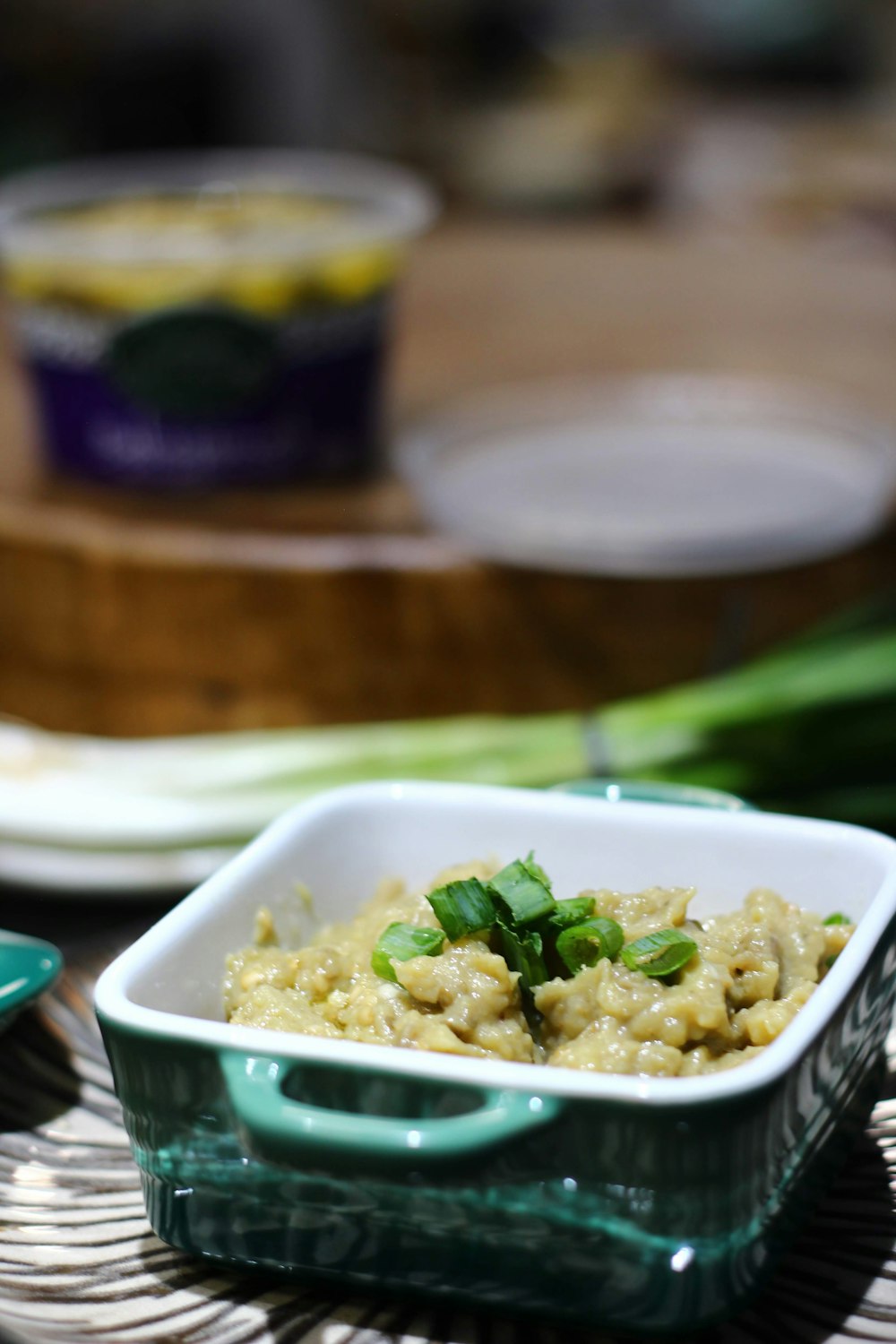 white ceramic bowl with green vegetable dish