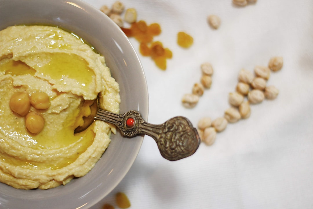 yellow ice cream on white ceramic bowl