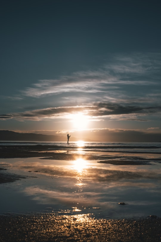 silhouette of person standing on beach during sunset in Salt Lake City United States