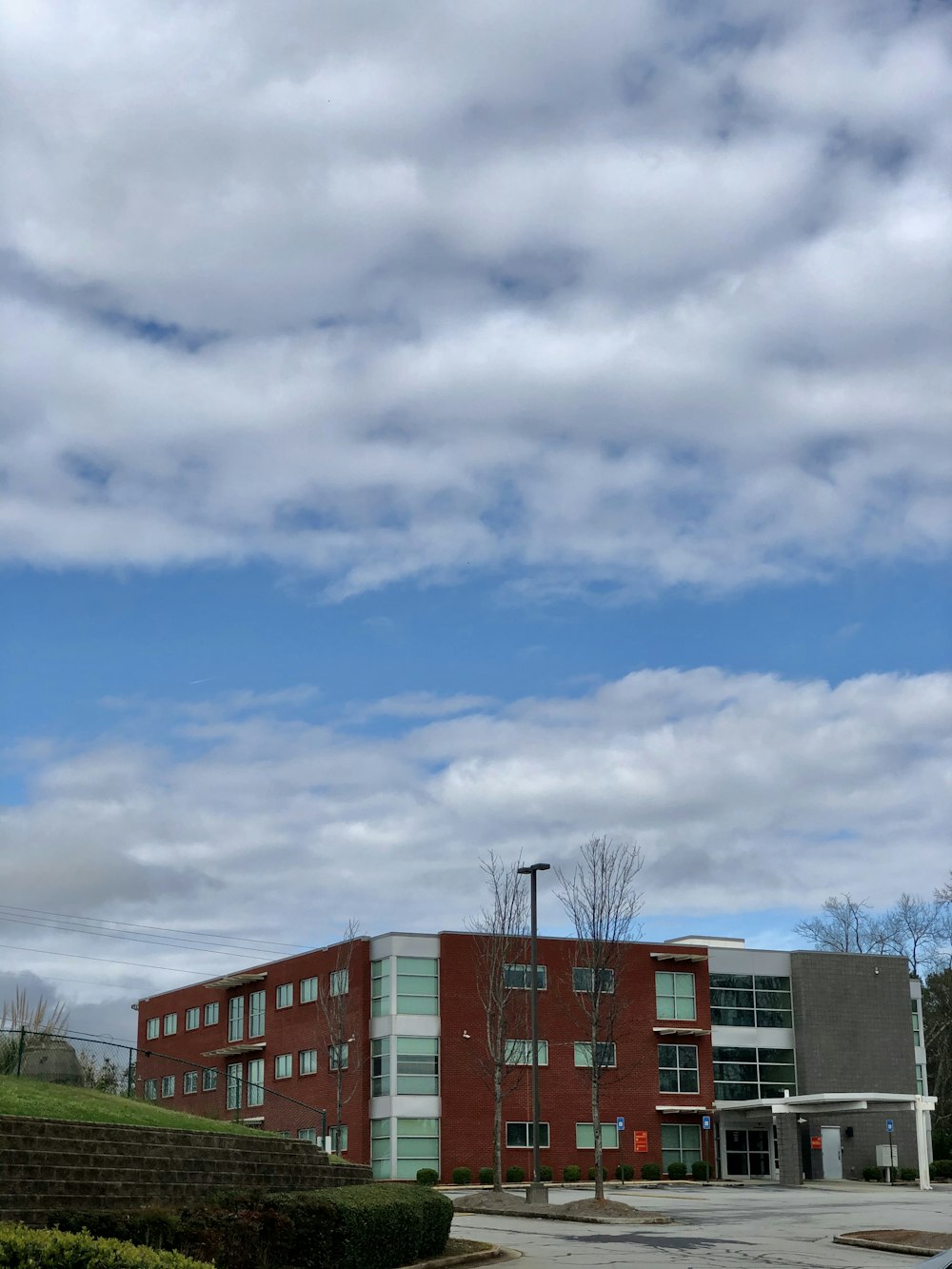 brown and white concrete building under blue sky during daytime