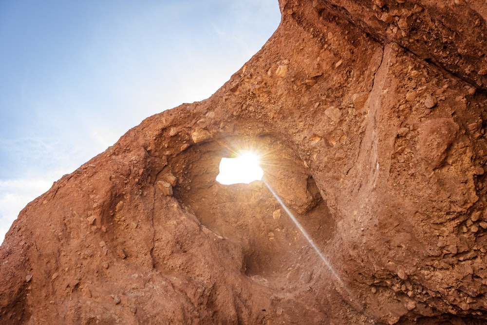 brown rock formation under blue sky during daytime