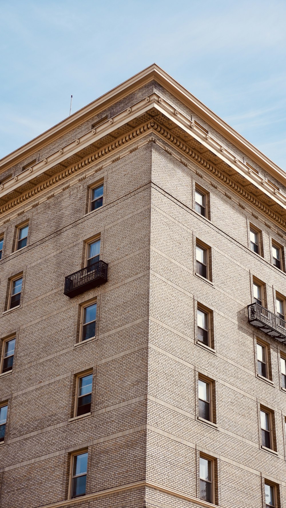 brown concrete building under blue sky during daytime