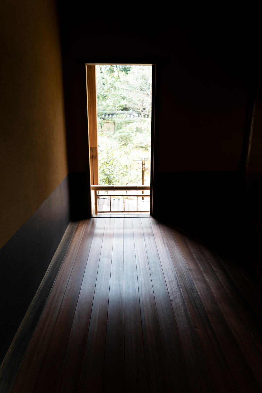 brown wooden floor and glass window