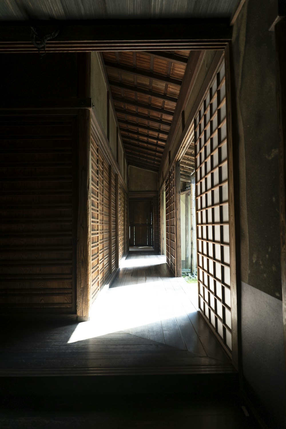 brown wooden door on brown concrete wall