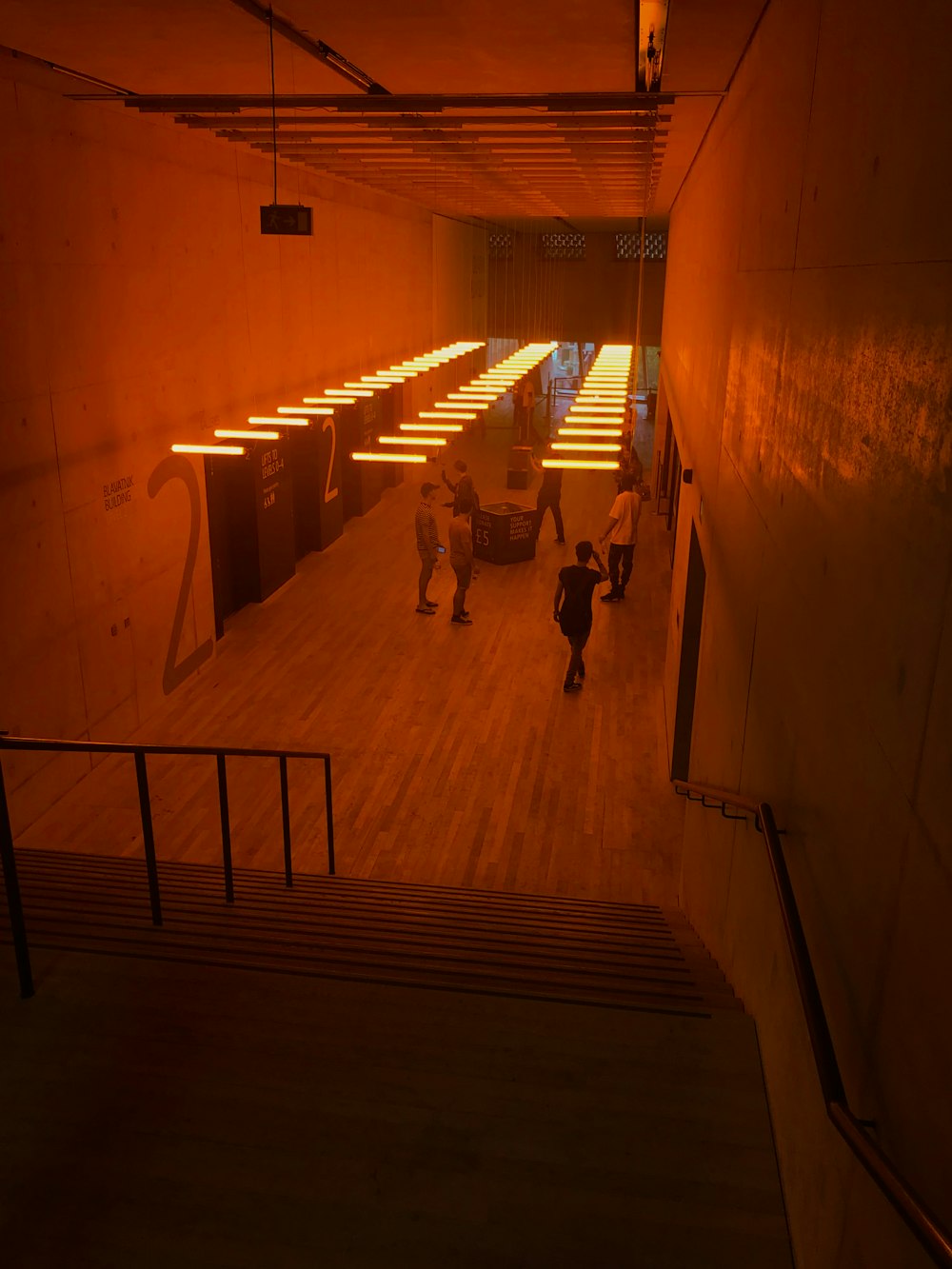 people walking on hallway during daytime