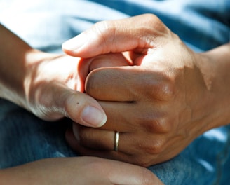 person wearing gold wedding band