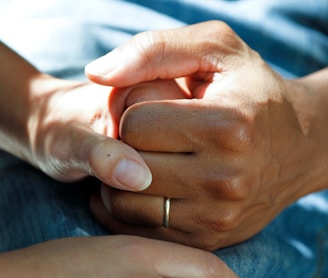 person wearing gold wedding band