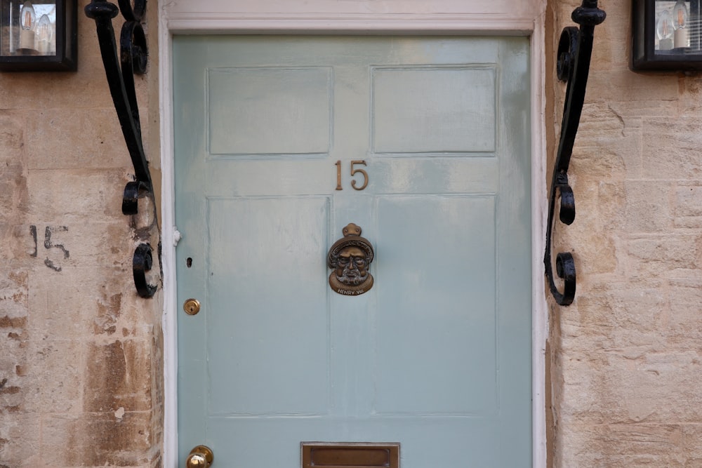 blue wooden door with gold door knob