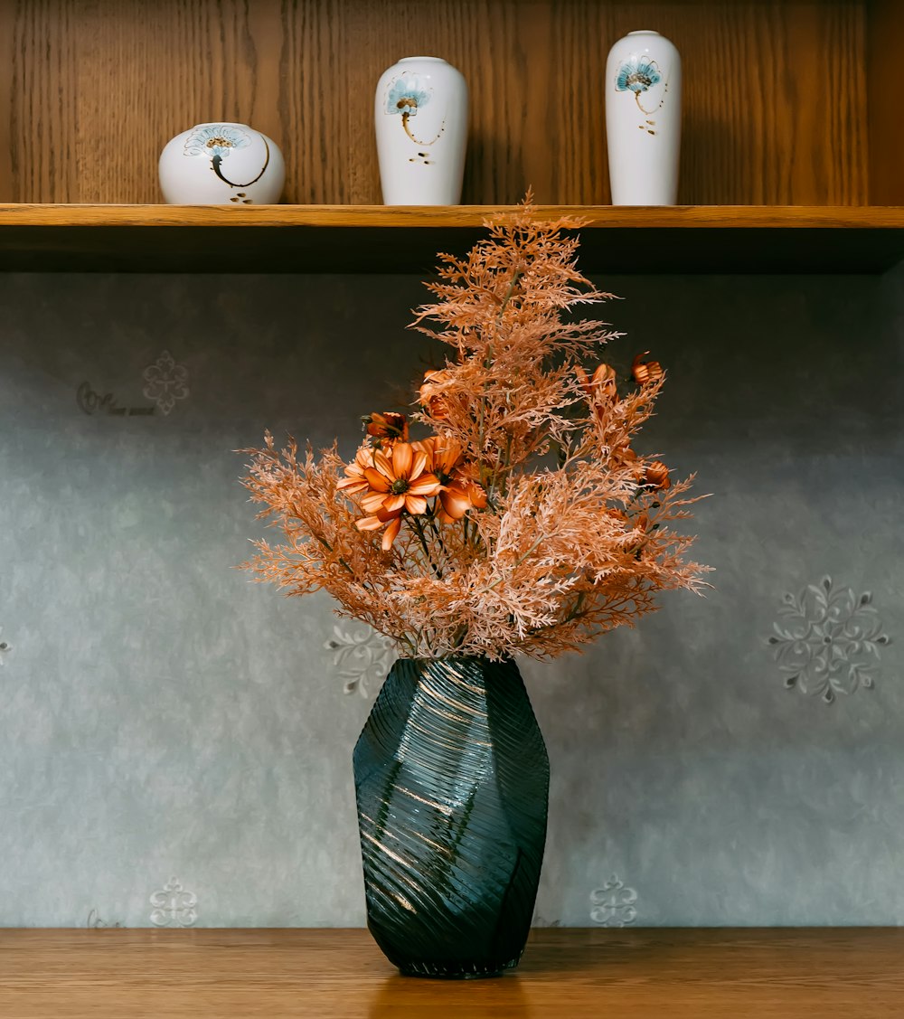 orange and yellow flowers in vase