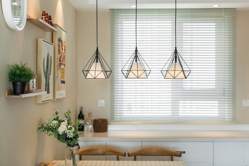 brown wooden table near white window blinds