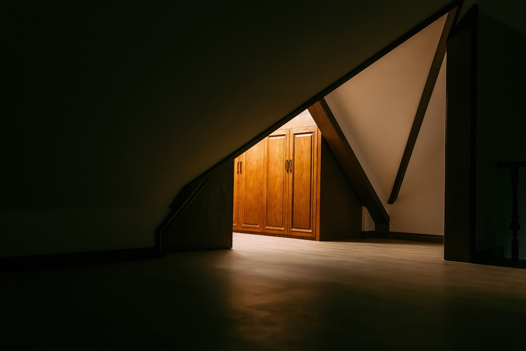 brown wooden door on white wall