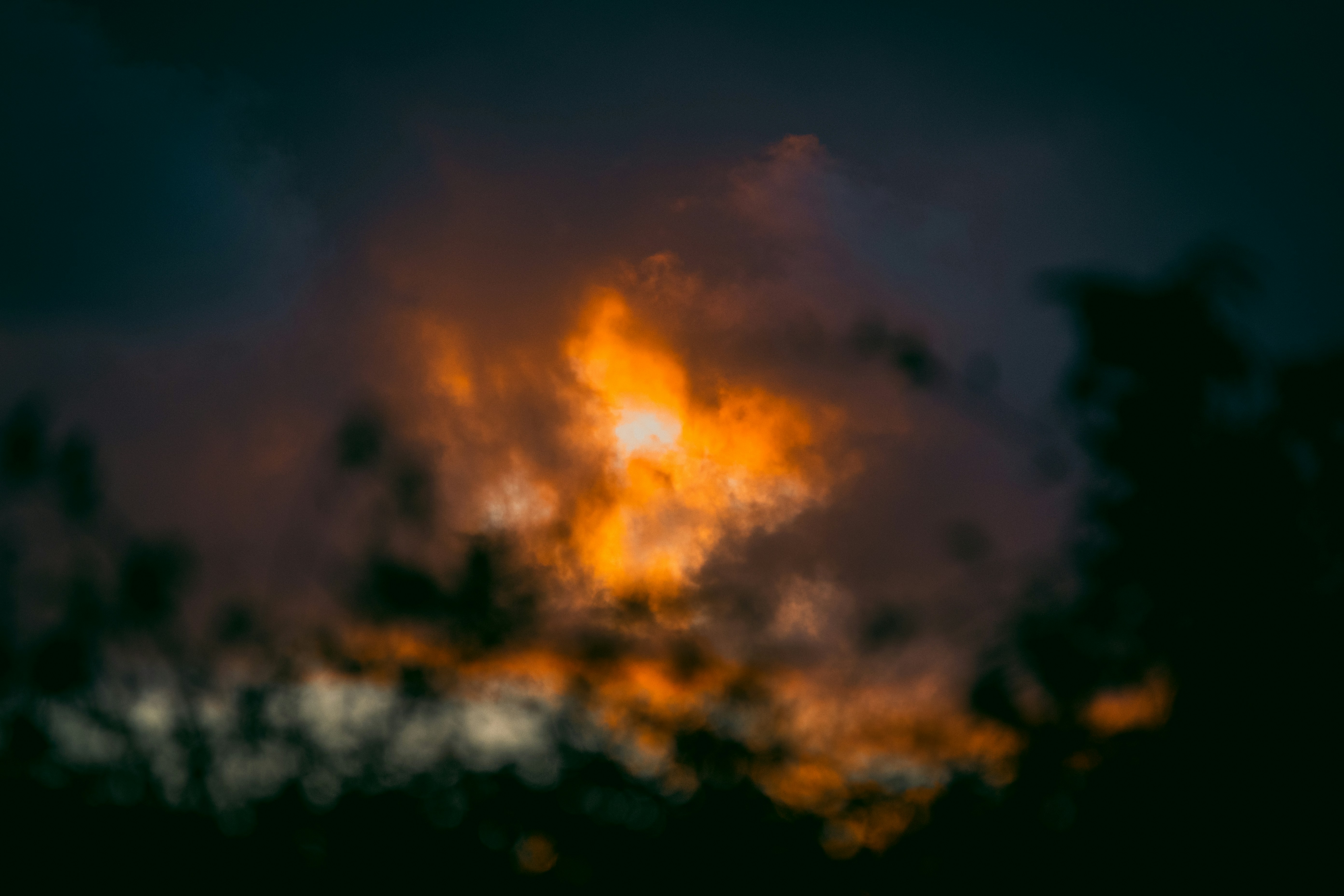 orange and black clouds during night time