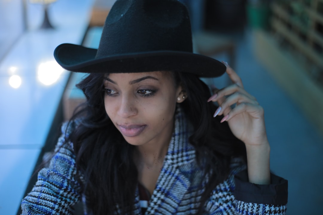 woman in black fedora hat