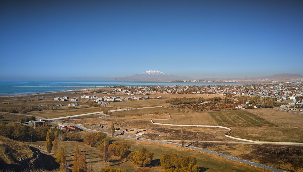 aerial view of city near body of water during daytime