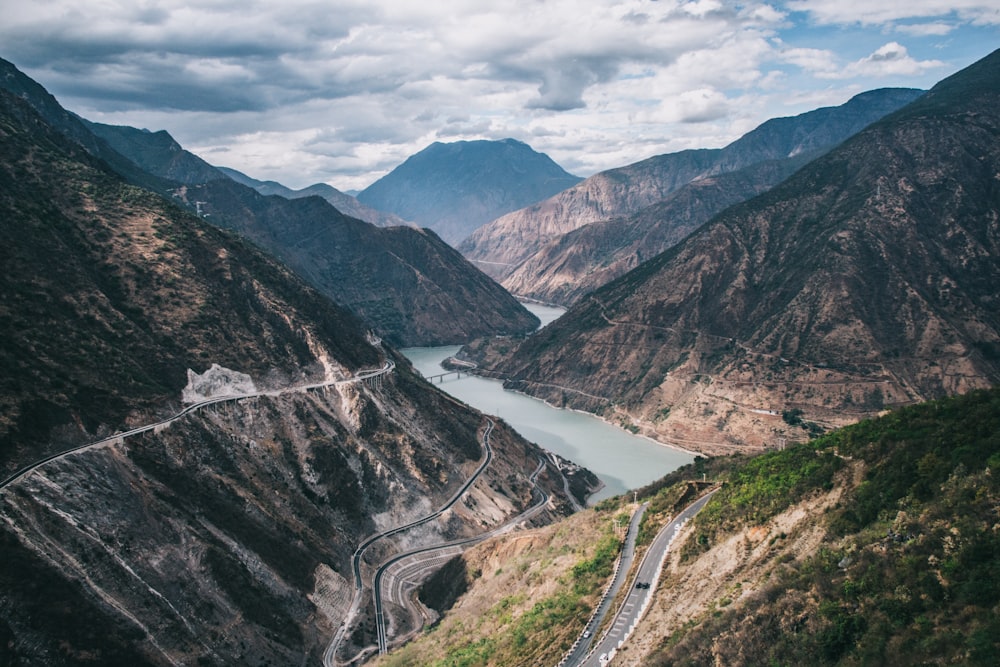 aerial view of road between mountains during daytime