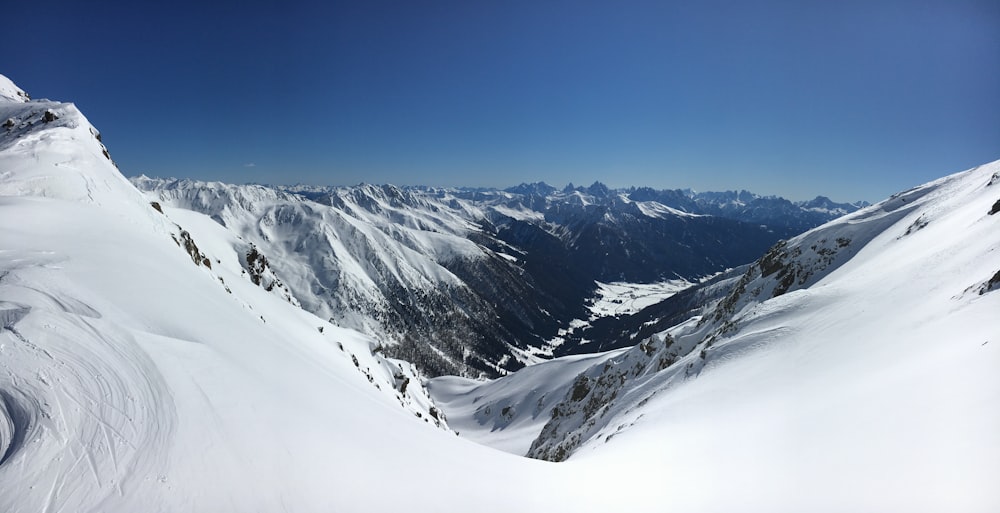 snow covered mountain under blue sky during daytime