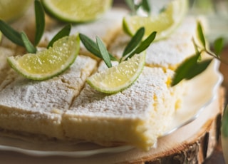 sliced bread with green vegetable on white ceramic plate