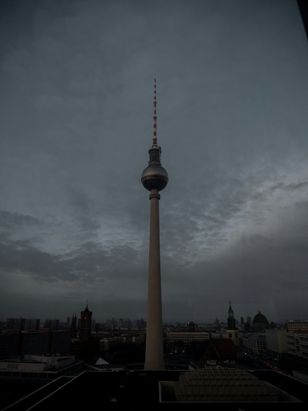 white and brown tower under cloudy sky during daytime