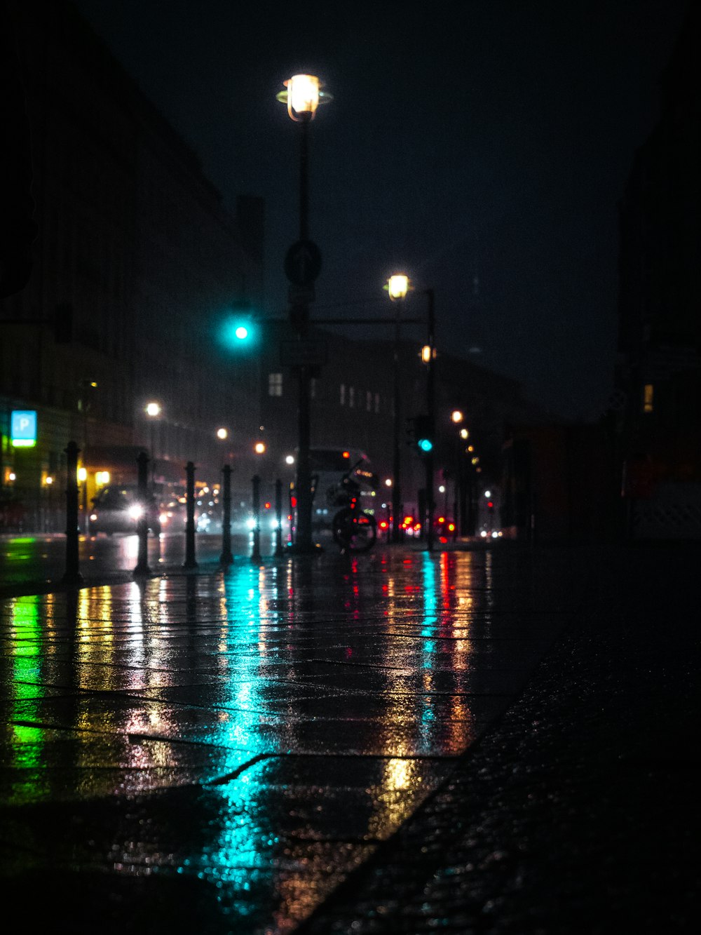 people walking on sidewalk during night time