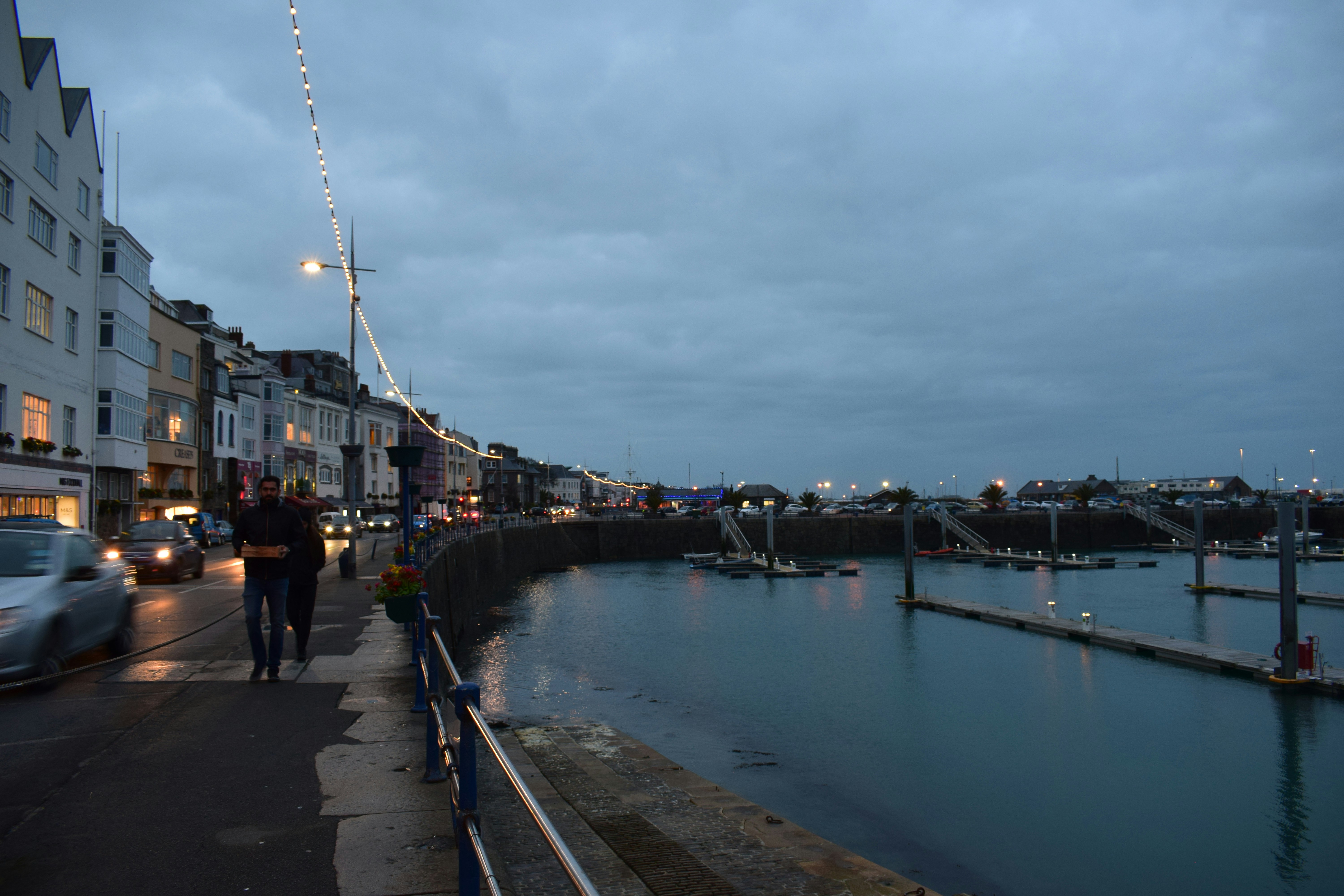 people walking on dock during daytime