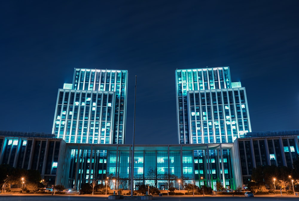 blue and white concrete building during night time