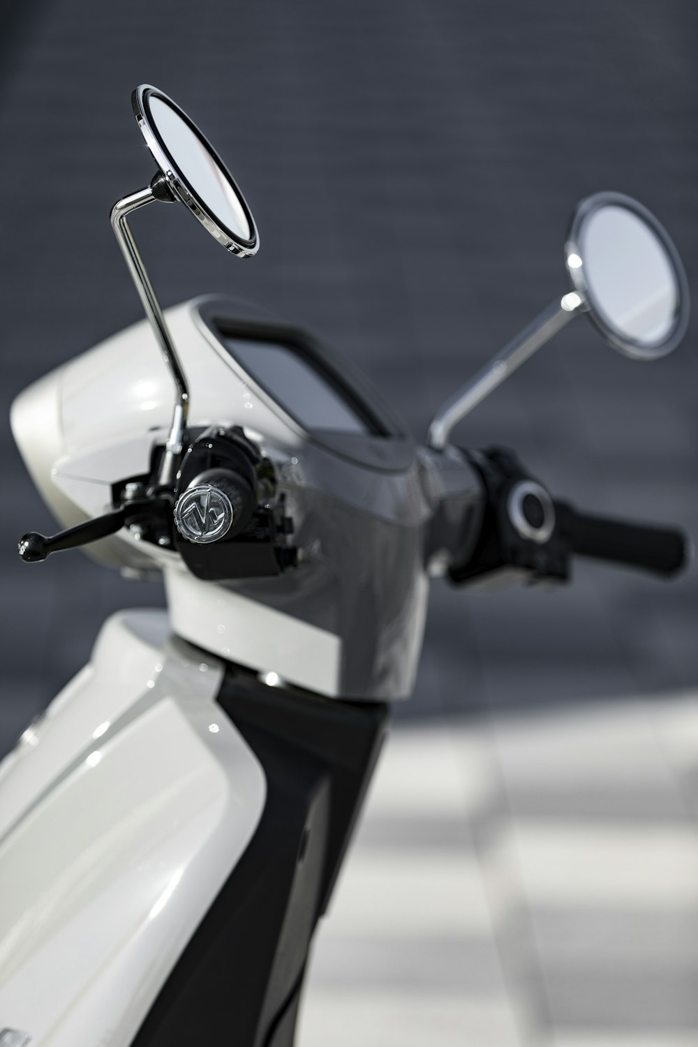 white and black motor scooter