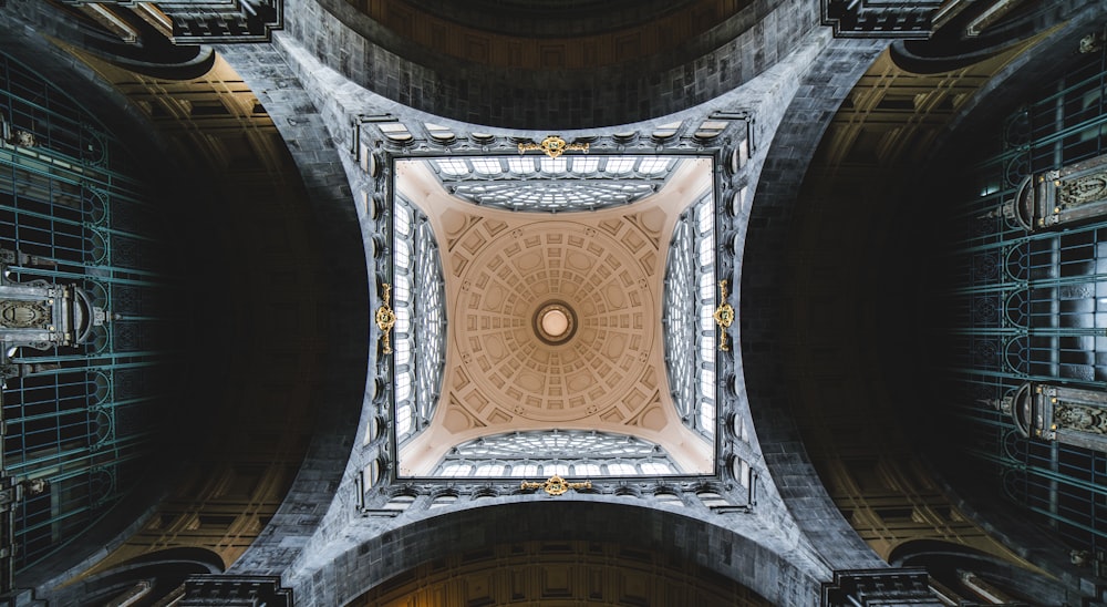 low angle photography of brown and white ceiling