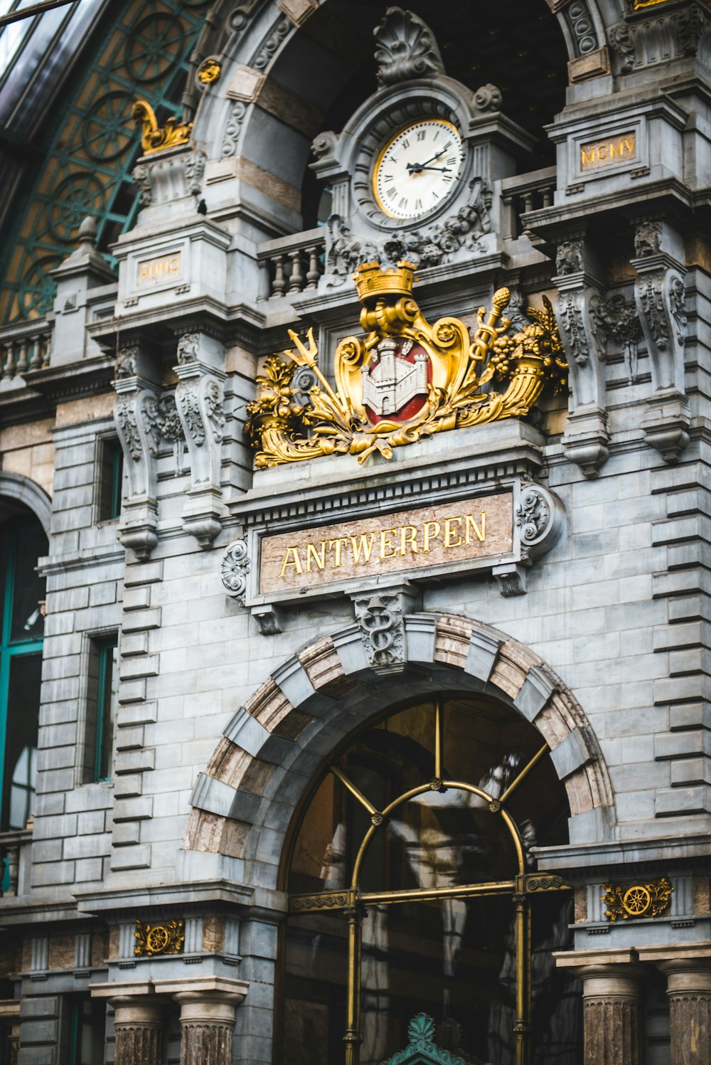 gray concrete building with gold and black lion print