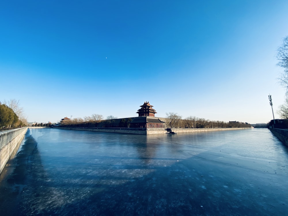 brown wooden dock on body of water during daytime