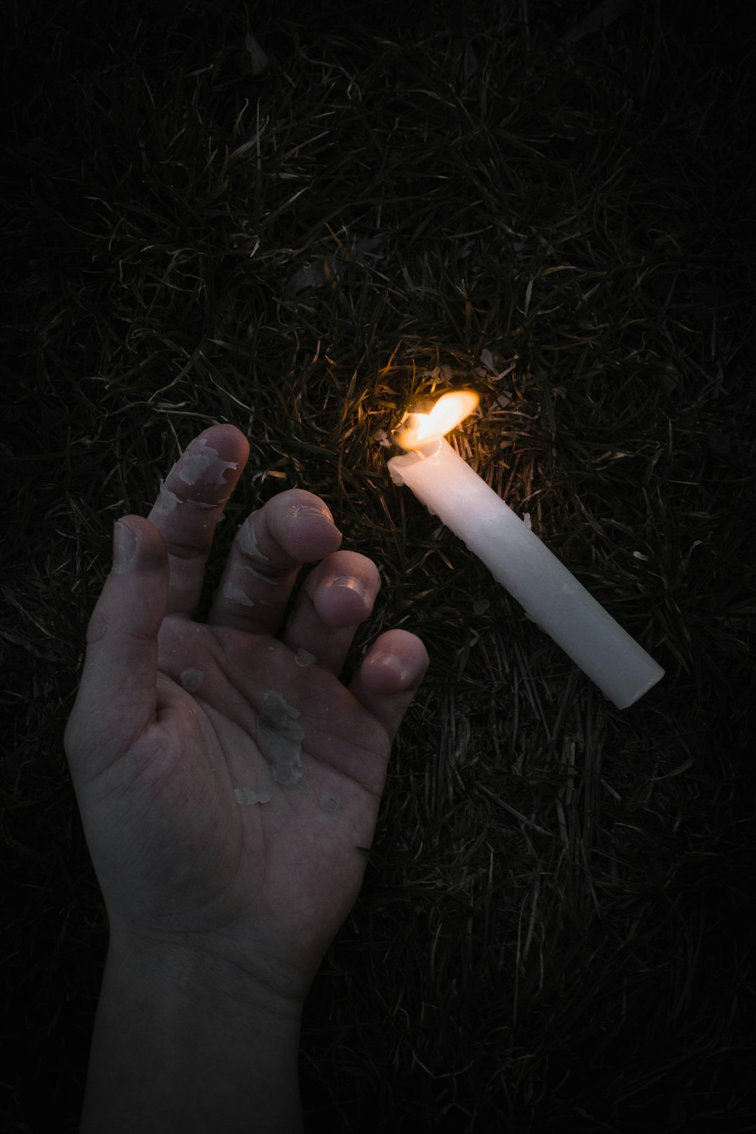 person holding lighted fire during nighttime
