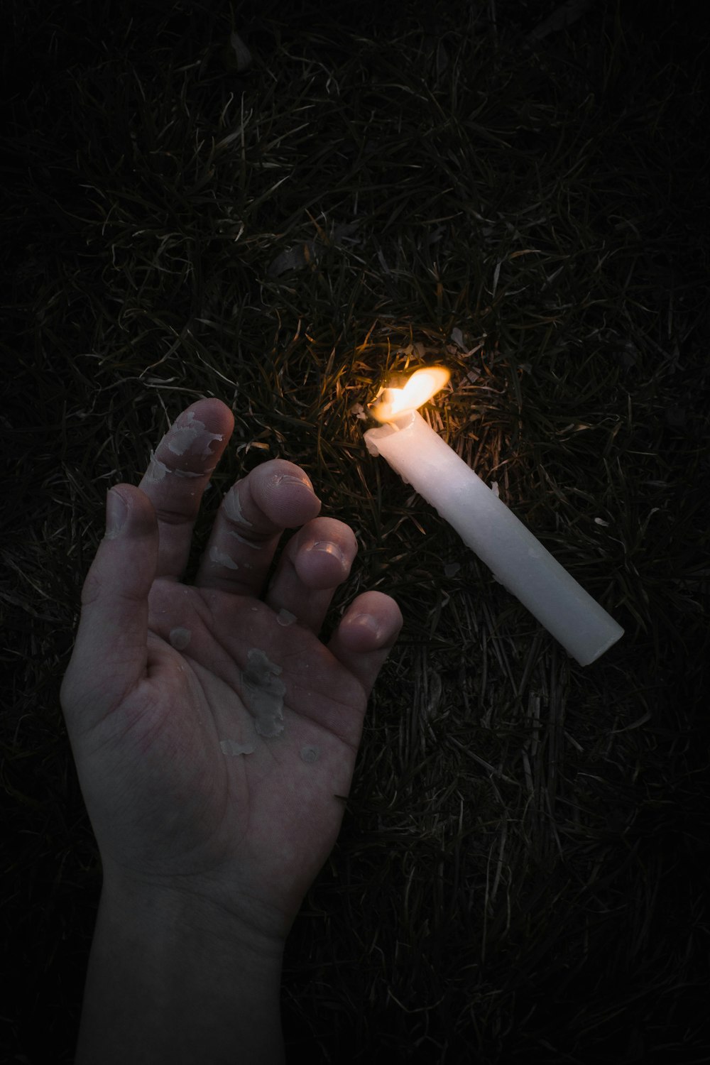 person holding lighted fire during nighttime