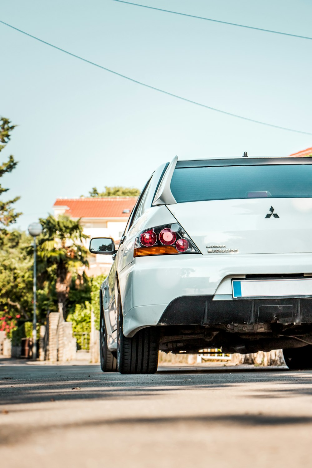 white chevrolet car on road during daytime