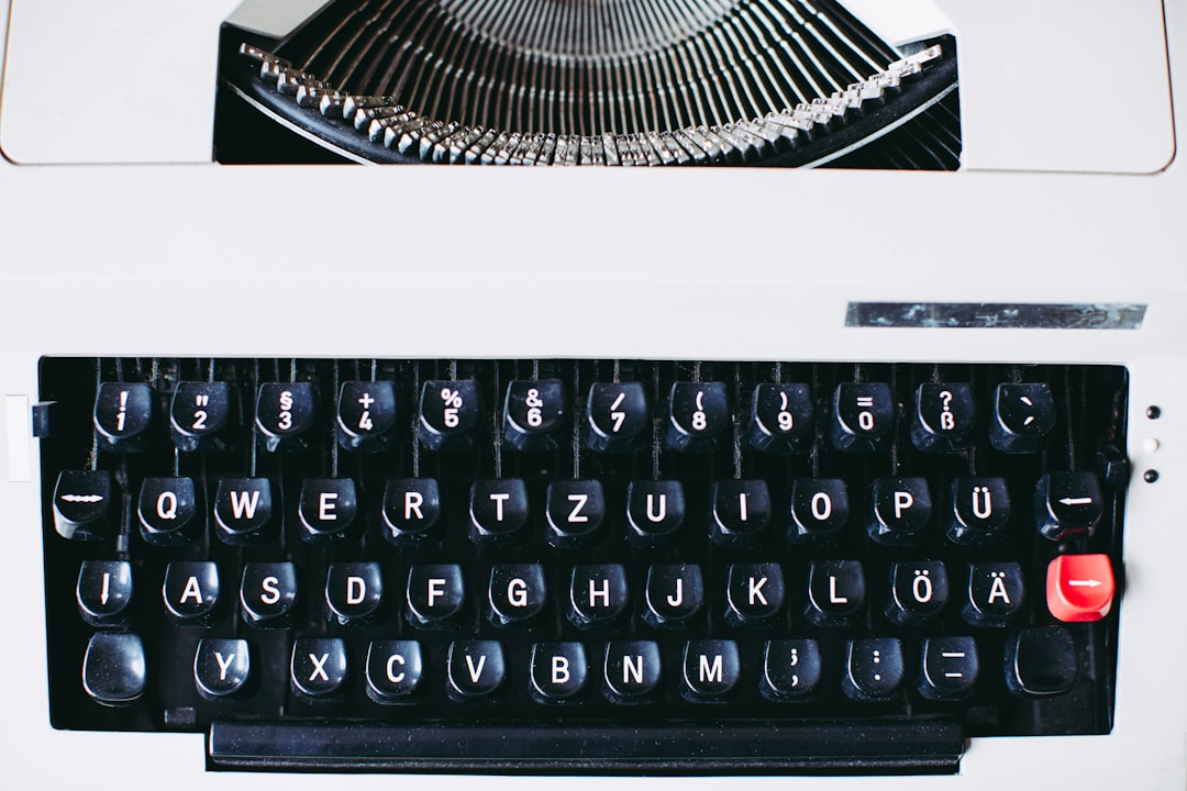 black and white typewriter on white table