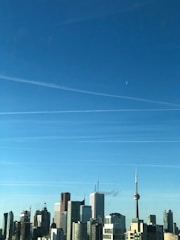 Canadian flag with Toronto’s skyline featuring the CN Tower.