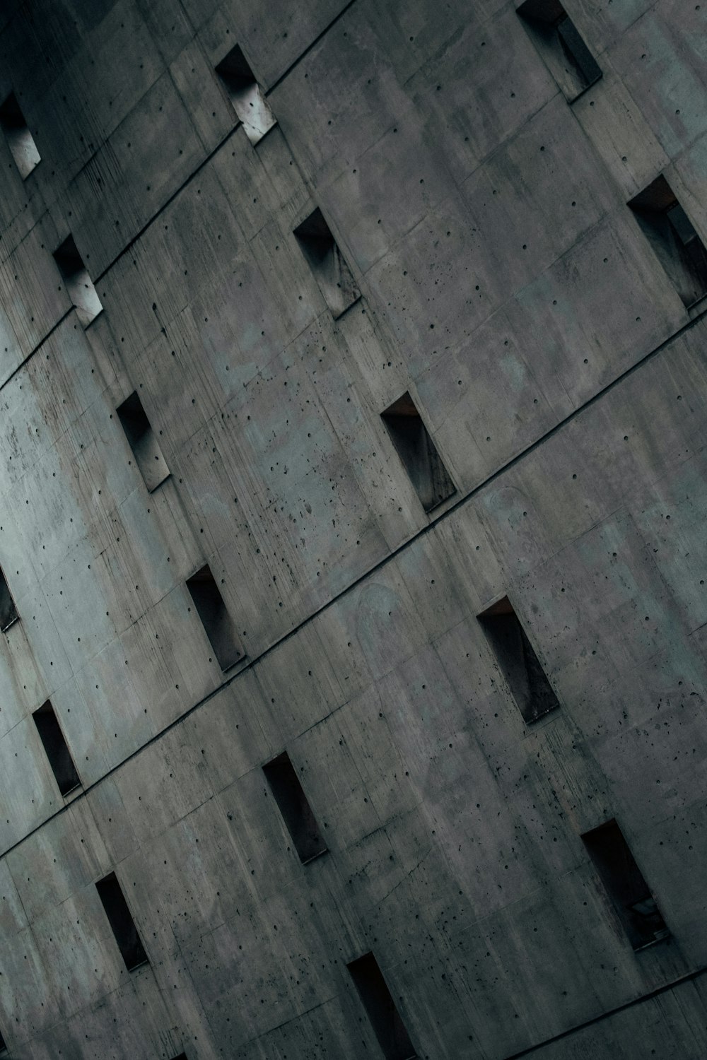 white light bulb on gray concrete building